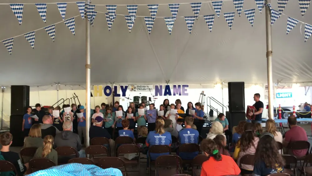The children’s choir singing under Bavarian bunting at the festival opening